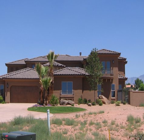Two story home in southern utah with tiled roofing installed by stout roofing.