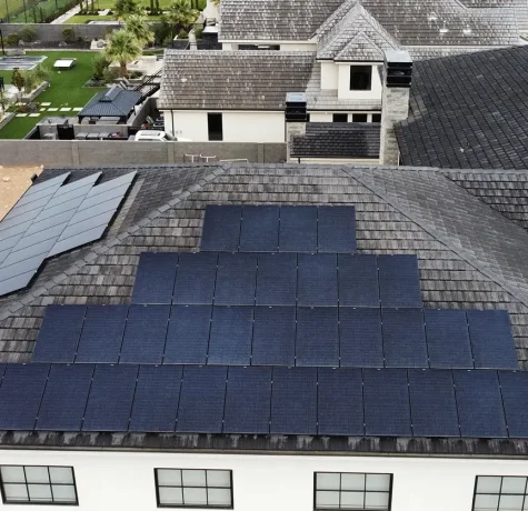 Solar panels installed on low pitch roof by stout roofing in southern utah.