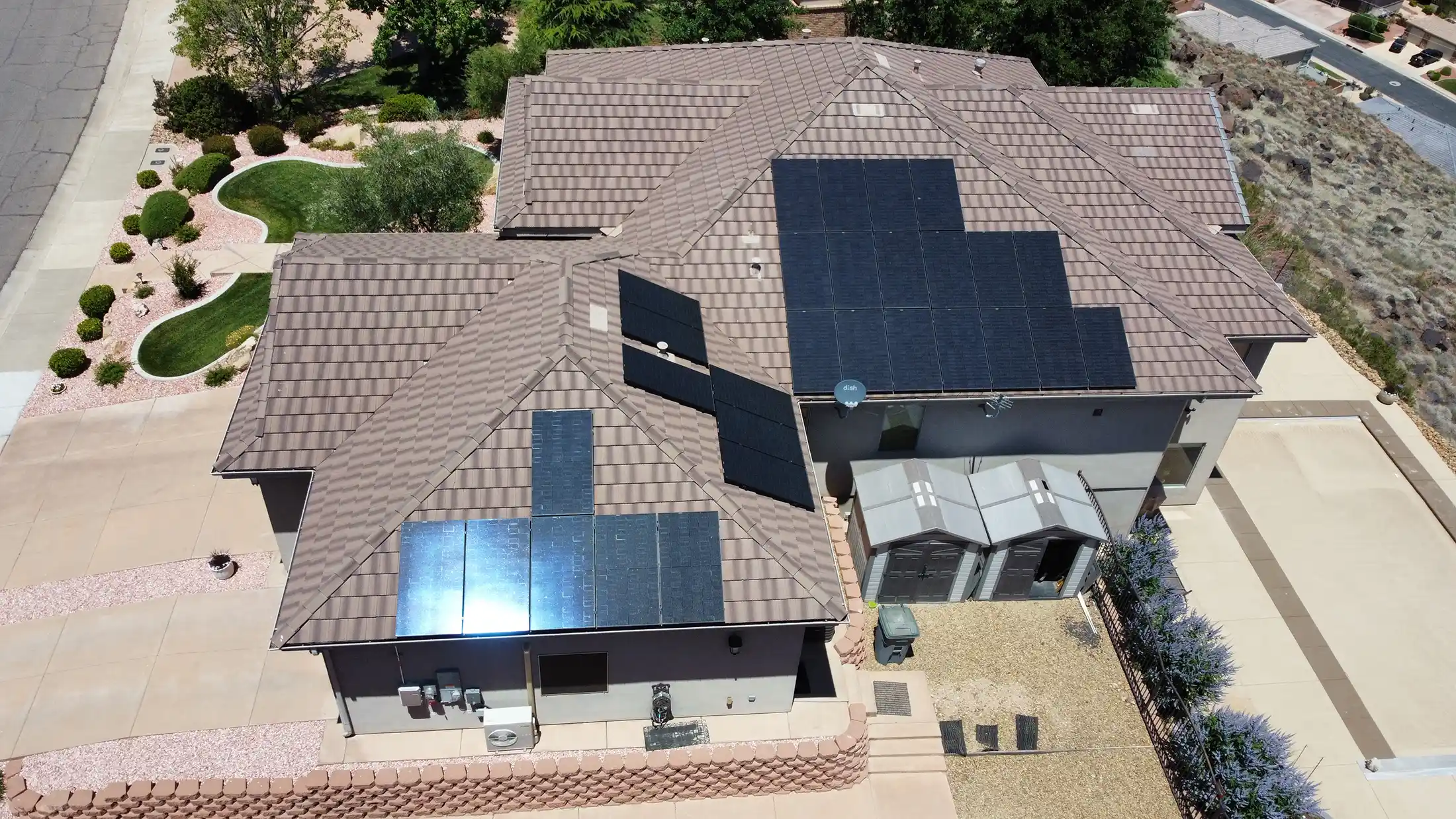 Roof in st george with solar panel at different angles on the roof.