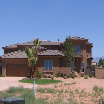 Two story home in southern utah with tiled roofing installed by stout roofing.